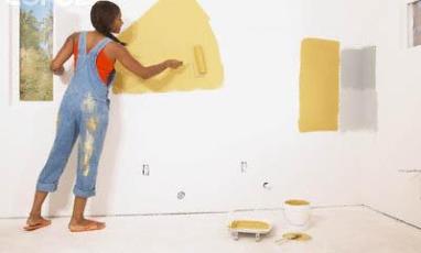 person painting wall
